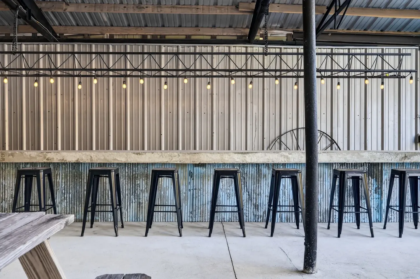 Stool seating along the outdoor bar